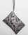 Stains silver clutch bag