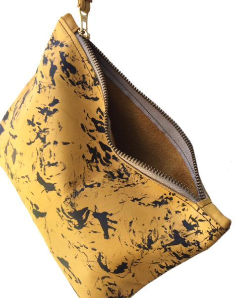 Stains yellow clutch bag
